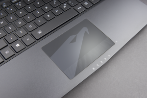 6. The X3 Plus trackpad features a chemical tempered strengthened glass with the iconic AORUS falcon brand logo printed underneath.