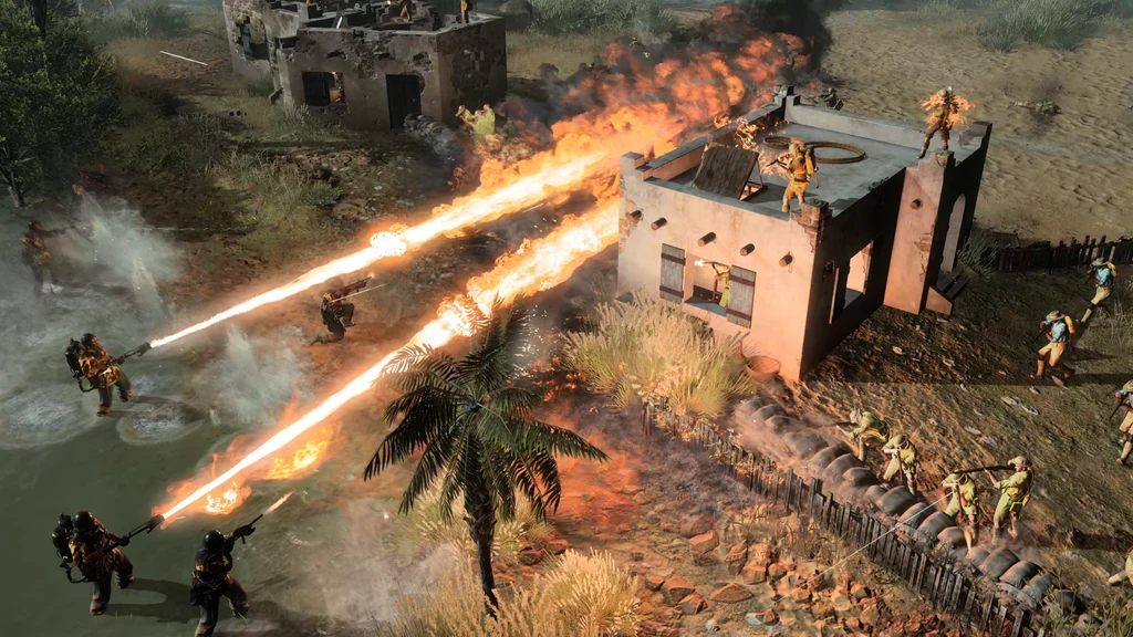 Mehrere Flammenwerfer feuern neben einem beschädigten Gebäude in Company of Heroes 3: Final Stand